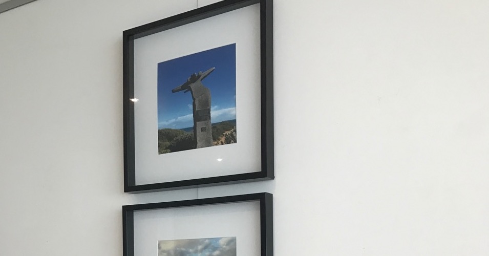 hanging in a column using a picture hanging system